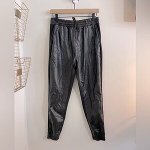 Reebok - black patent leather in front and joggers style in rear